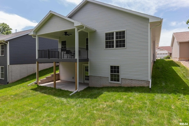 7 Welcome Center Ct, Le Claire, IA 52753 - back of property with a ceiling fan, a lawn, and a patio