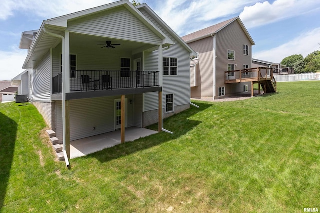 7 Welcome Center Ct, Le Claire, IA 52753 - rear view of house featuring a yard, ceiling fan, a patio, and a wooden deck