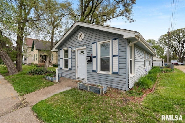 view of front facade with a front lawn and a garage