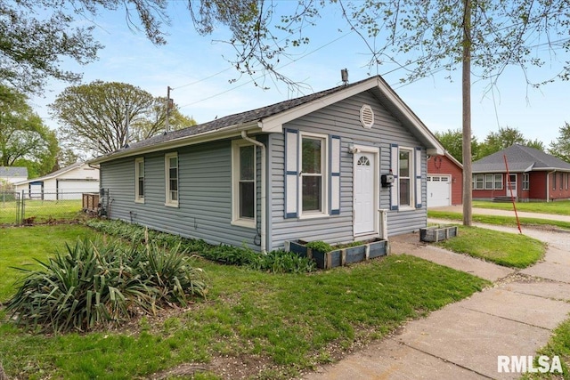 bungalow-style house with a detached garage