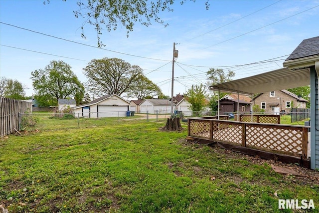 view of yard with a storage unit, an outbuilding, and a detached garage