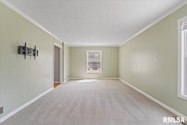 4690 Lindbergh Dr, Bettendorf, IA 52722 - unfurnished room featuring carpet, baseboards, crown molding, and a textured ceiling