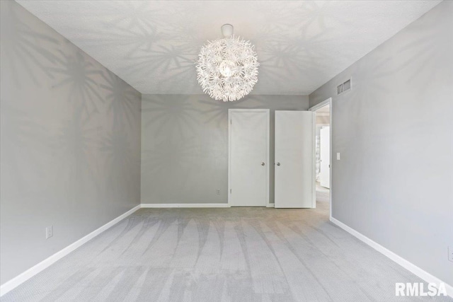 4690 Lindbergh Dr, Bettendorf, IA 52722 - empty room featuring carpet, a chandelier, and baseboards