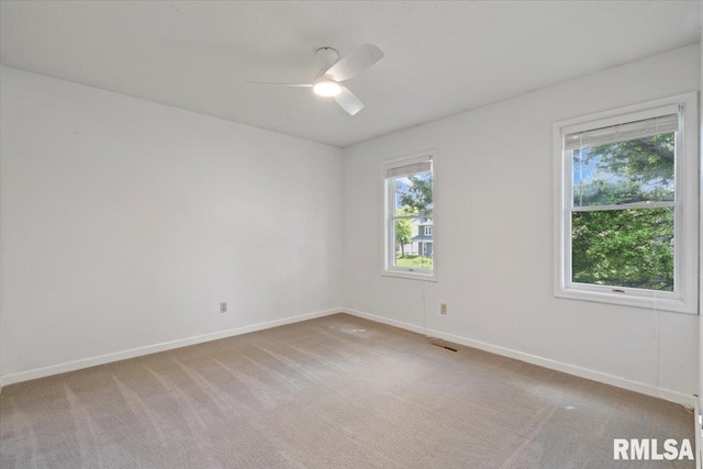 4690 Lindbergh Dr, Bettendorf, IA 52722 - empty room with a ceiling fan, baseboards, and light colored carpet