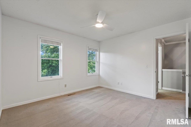 4690 Lindbergh Dr, Bettendorf, IA 52722 - unfurnished bedroom featuring carpet floors, baseboards, and ceiling fan