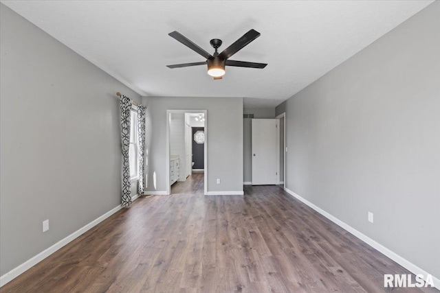 4690 Lindbergh Dr, Bettendorf, IA 52722 - unfurnished bedroom with wood finished floors, baseboards, and a ceiling fan