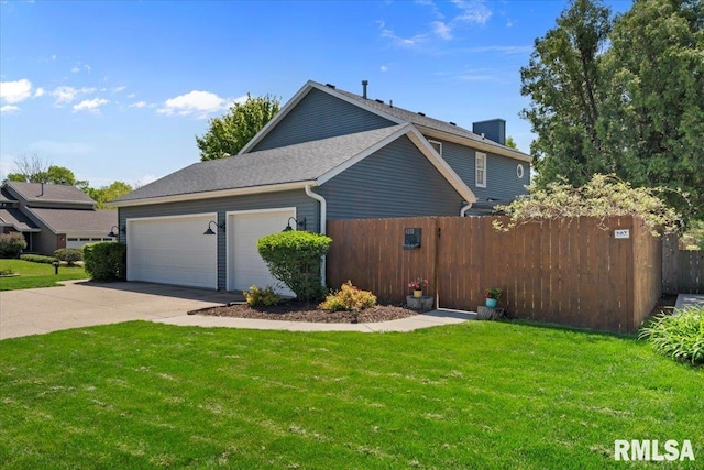 4690 Lindbergh Dr, Bettendorf, IA 52722 - view of home's exterior featuring driveway and a garage