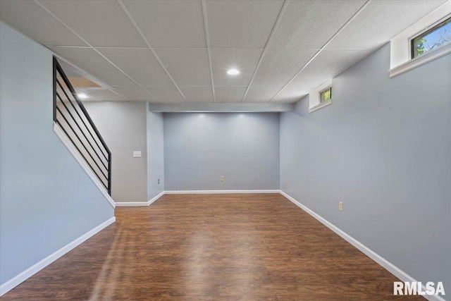 4690 Lindbergh Dr, Bettendorf, IA 52722 - below grade area featuring wood finished floors, stairway, recessed lighting, baseboards, and healthy amount of natural light