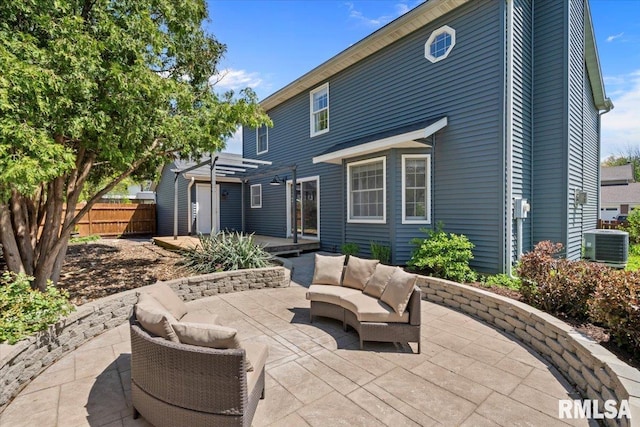 4690 Lindbergh Dr, Bettendorf, IA 52722 - back of house with a patio, an outdoor hangout area, fence, a pergola, and central air condition unit