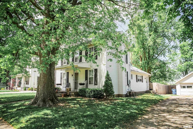 129 E High St, Mendon, IL 62351 - view of front facade with covered porch and central AC