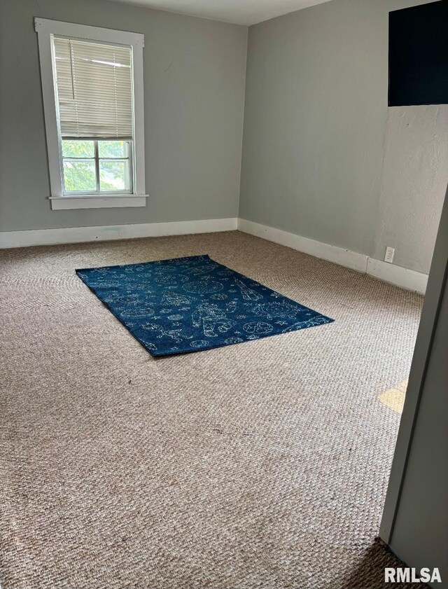 129 E High St, Mendon, IL 62351 - unfurnished room featuring carpet flooring and baseboards