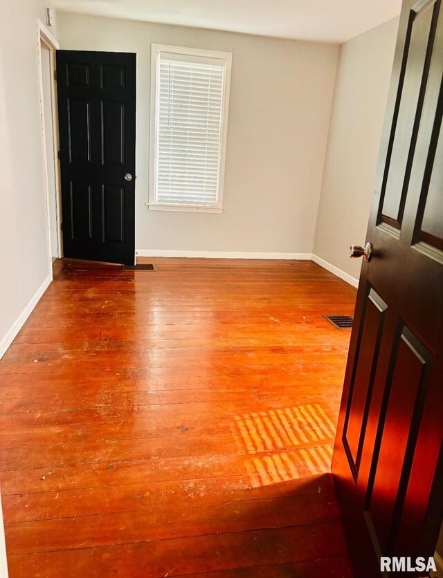 129 E High St, Mendon, IL 62351 - foyer entrance with hardwood / wood-style flooring and baseboards