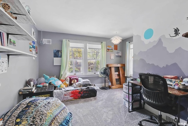 carpeted bedroom featuring a desk