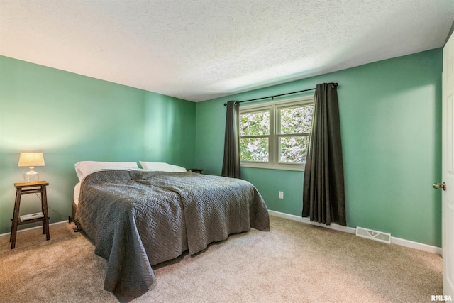 1960 Tam-O-Shanter Dr, Bettendorf, IA 52722 - bedroom with carpet, baseboards, and a textured ceiling
