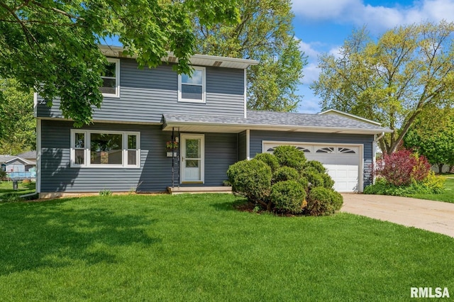 1960 Tam-O-Shanter Dr, Bettendorf, IA 52722 - view of front of home featuring a garage, driveway, and a front lawn