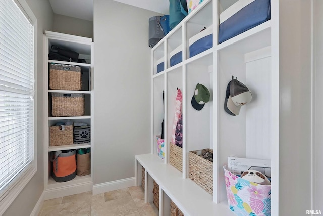 mudroom with plenty of natural light and baseboards