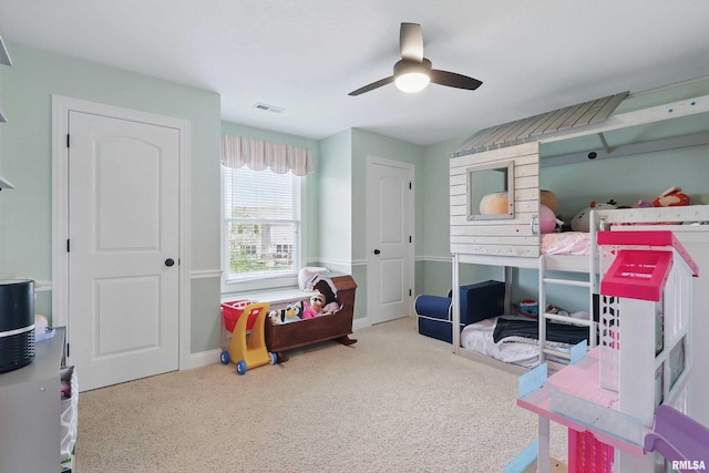 playroom featuring carpet flooring, a ceiling fan, and baseboards