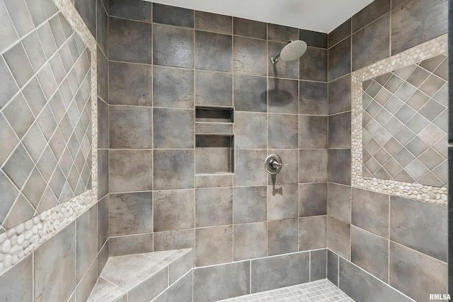 full bathroom with tiled shower