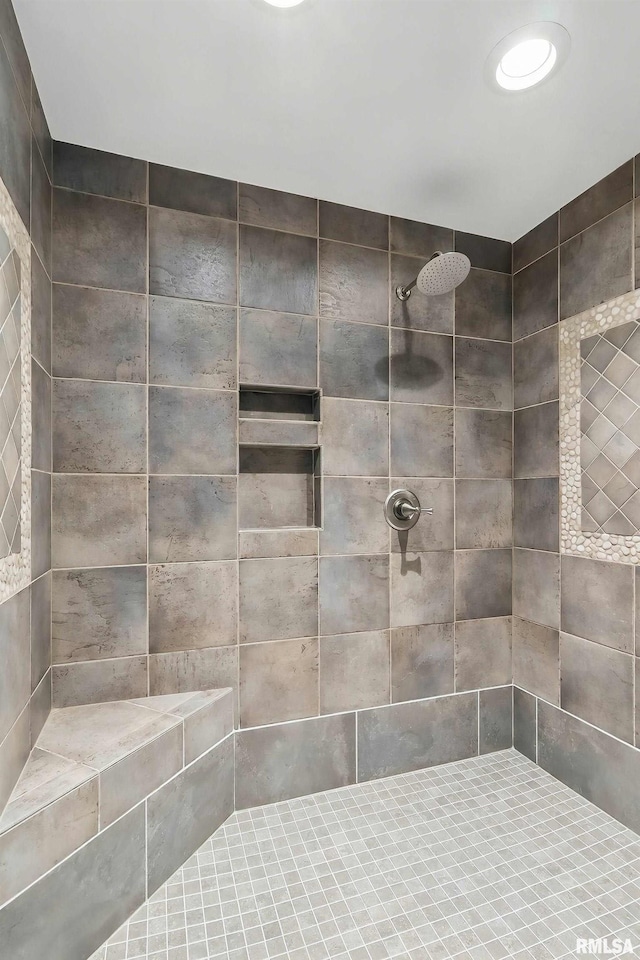 full bathroom with tiled shower