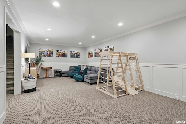 living room with carpet, a decorative wall, ornamental molding, recessed lighting, and stairway
