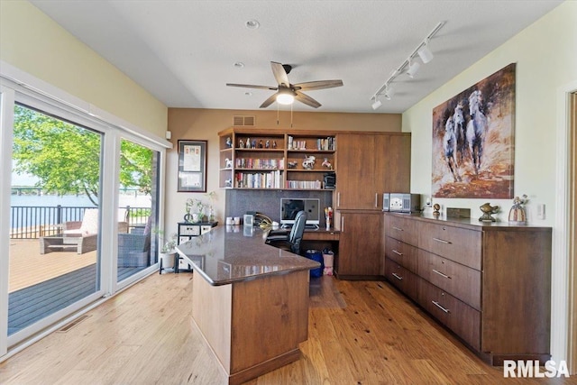 office area featuring ceiling fan, track lighting, and light wood-style flooring