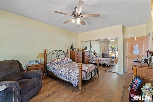 bedroom featuring hardwood / wood-style flooring, a closet, and ceiling fan