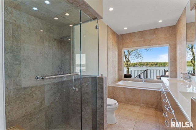 full bathroom featuring a shower stall, a bath, recessed lighting, toilet, and tile patterned flooring