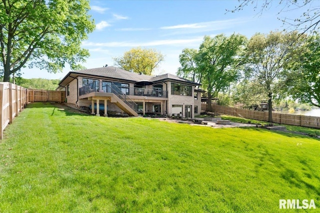 rear view of house with stairs, a wooden deck, and a patio area