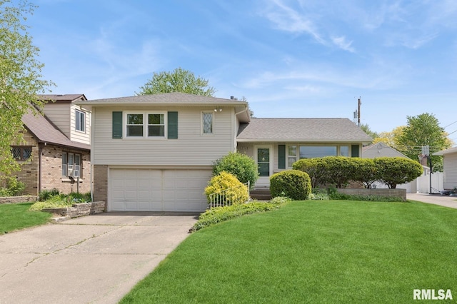 2528 28th St, Moline, IL 61265 - split level home featuring an attached garage, a front lawn, and driveway