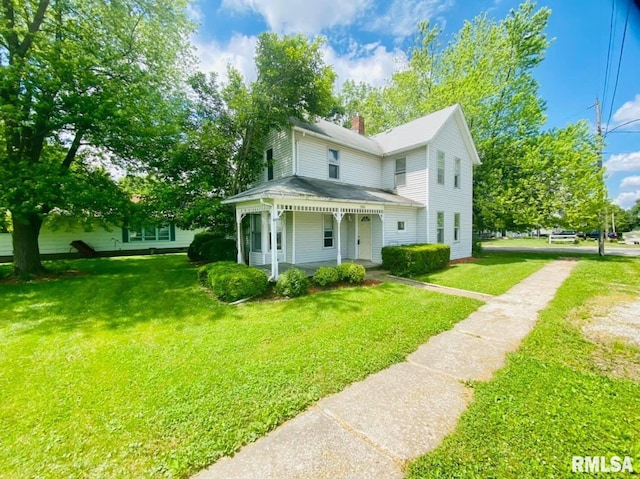 1202 17th Ave, Viola, IL 61486 - victorian home with a chimney, a front lawn, and a porch
