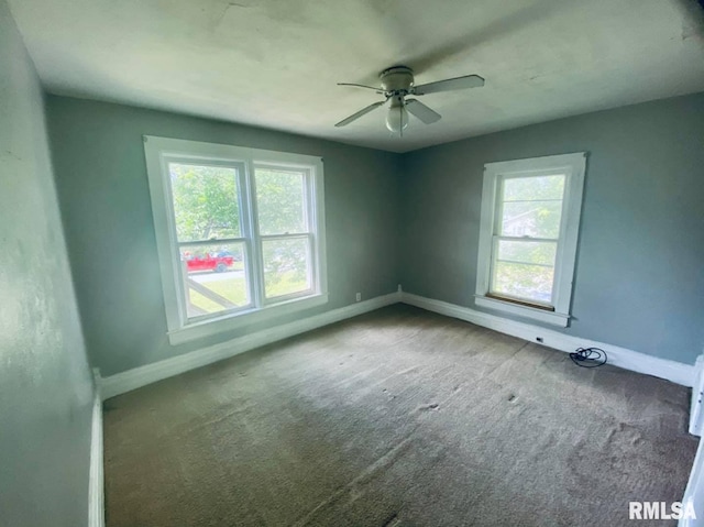 1202 17th Ave, Viola, IL 61486 - carpeted empty room with baseboards and a ceiling fan