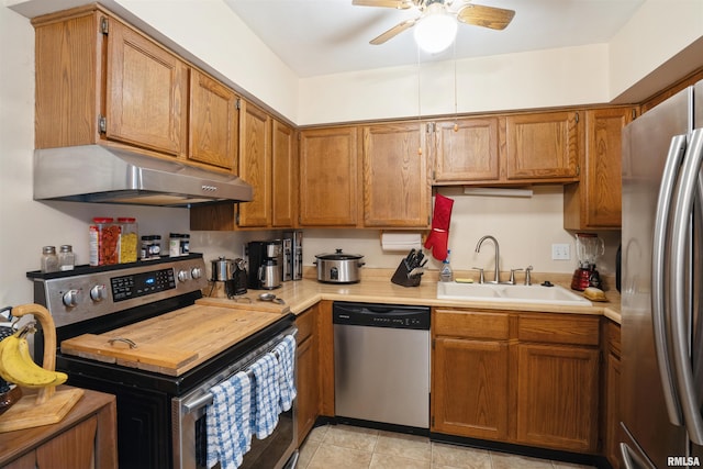 2505 26th Avenue Ct Unit J, Rock Island, IL 61201 - kitchen featuring stainless steel appliances, under cabinet range hood, a sink, and light countertops