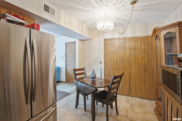 2505 26th Avenue Ct Unit J, Rock Island, IL 61201 - dining room with a chandelier