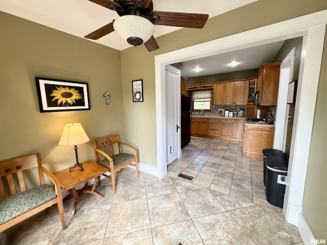 101 S Stewart St, Geneseo, IL 61254 - living area featuring ceiling fan, baseboards, and light tile patterned floors