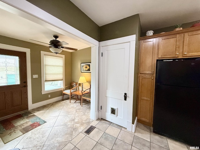101 S Stewart St, Geneseo, IL 61254 - mudroom featuring light tile patterned floors, baseboards, and a ceiling fan