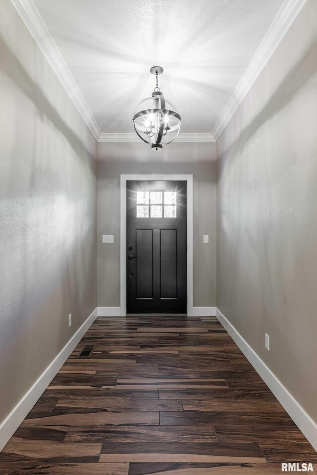 3972 Baptist Camp Rd, Carterville, IL 62918 - entrance foyer with a chandelier, dark wood finished floors, baseboards, and crown molding