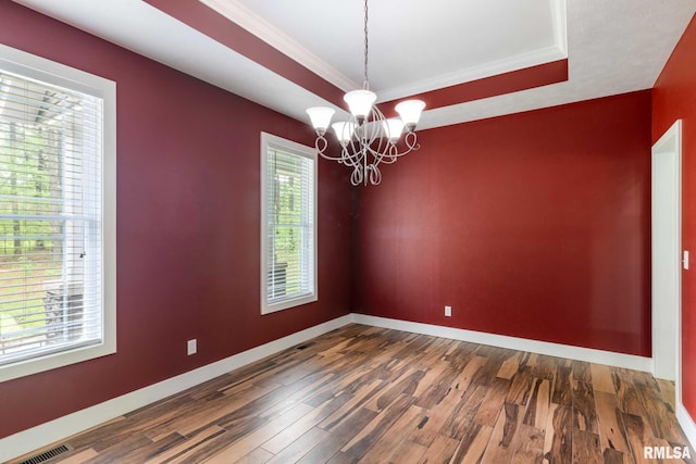 3972 Baptist Camp Rd, Carterville, IL 62918 - empty room featuring a chandelier, dark wood finished floors, baseboards, a raised ceiling, and crown molding