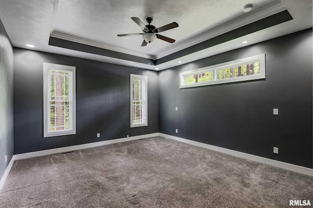 3972 Baptist Camp Rd, Carterville, IL 62918 - spare room with ornamental molding, a raised ceiling, carpet flooring, baseboards, and a ceiling fan