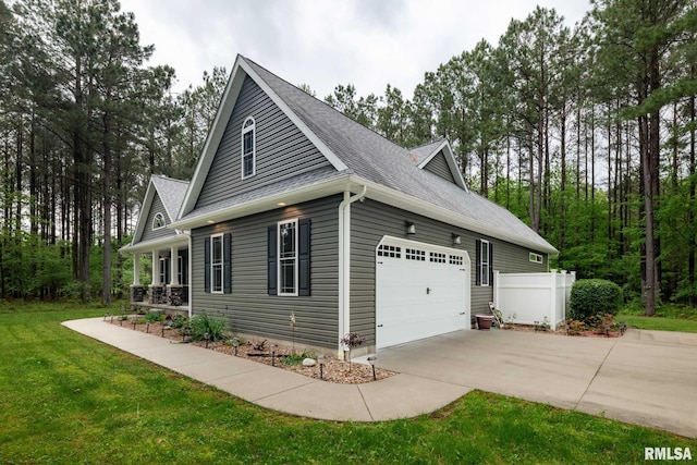 3972 Baptist Camp Rd, Carterville, IL 62918 - view of home's exterior featuring concrete driveway, a garage, and a shingled roof