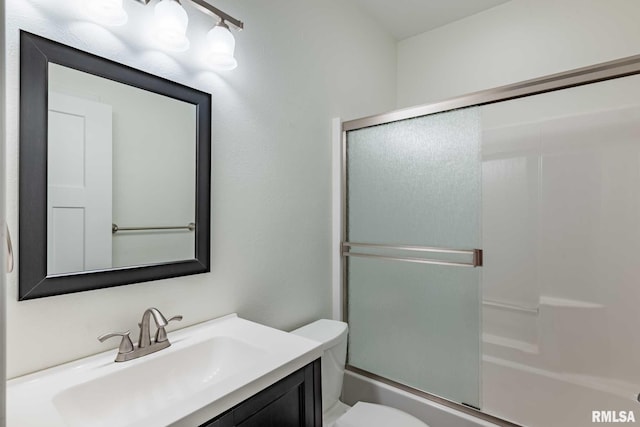 3972 Baptist Camp Rd, Carterville, IL 62918 - full bathroom featuring toilet, vanity, and combined bath / shower with glass door