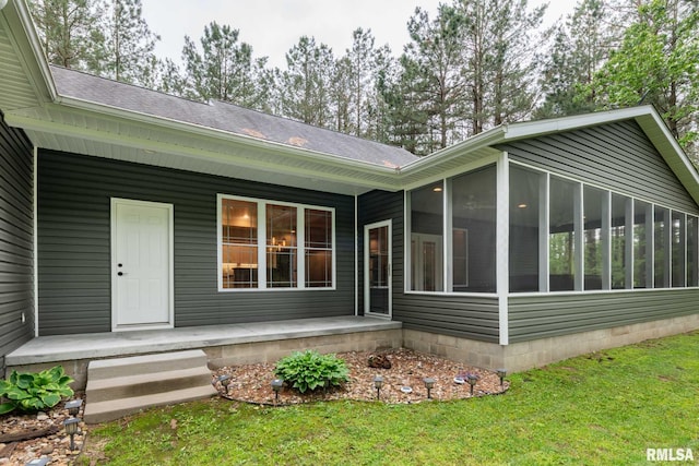 3972 Baptist Camp Rd, Carterville, IL 62918 - rear view of house with a sunroom, roof with shingles, a yard, and covered porch