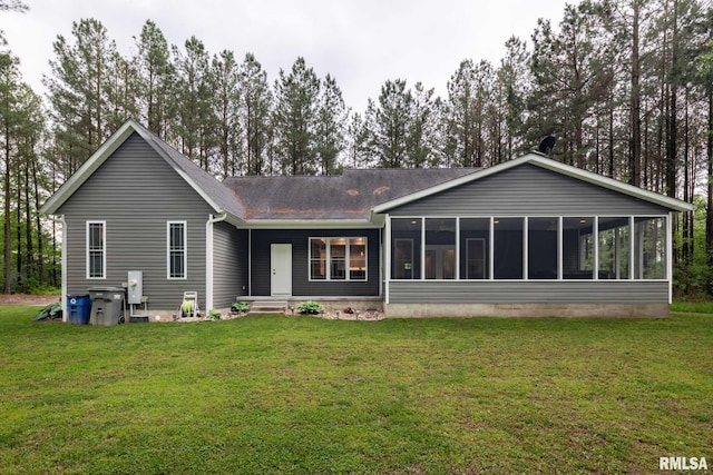 3972 Baptist Camp Rd, Carterville, IL 62918 - back of house featuring a sunroom, a lawn, and a shingled roof