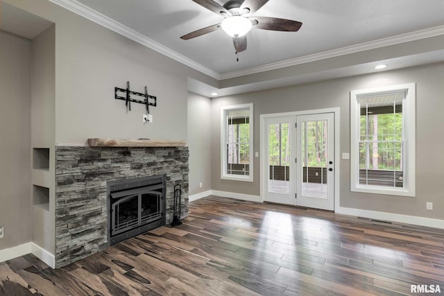 3972 Baptist Camp Rd, Carterville, IL 62918 - unfurnished living room featuring crown molding, a stone fireplace, baseboards, and dark wood finished floors