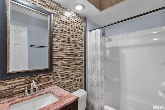 bathroom featuring decorative backsplash, toilet, vanity, tile walls, and shower / bath combination with curtain