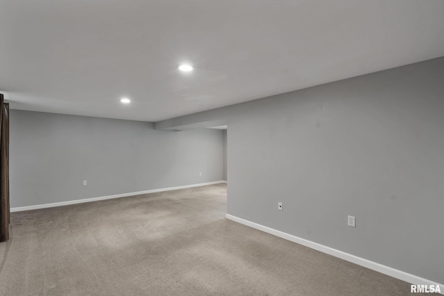 finished below grade area with recessed lighting, baseboards, and carpet floors