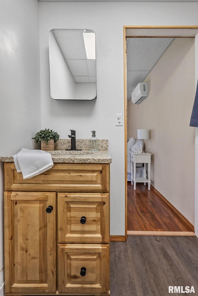 1709 Main St, Keithsburg, IL 61442 - bathroom with wood finished floors, baseboards, and vanity