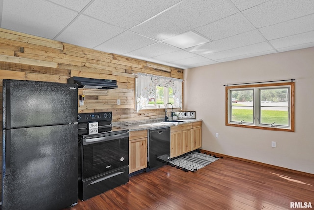 1709 Main St, Keithsburg, IL 61442 - kitchen with black appliances, a sink, exhaust hood, wooden walls, and a paneled ceiling