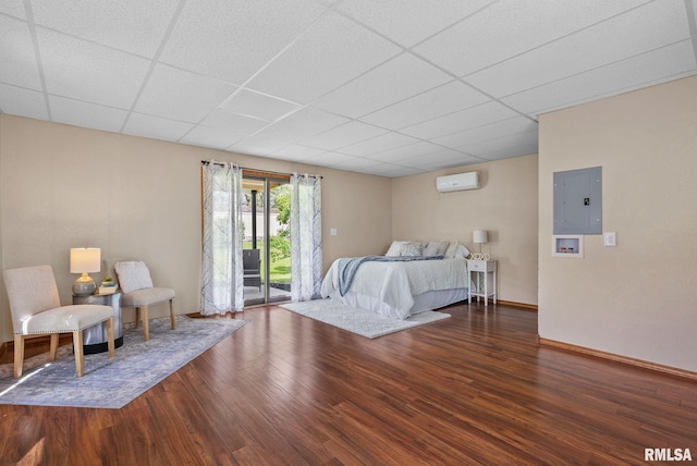 1709 Main St, Keithsburg, IL 61442 - bedroom with electric panel, wood finished floors, access to outside, a paneled ceiling, and a wall mounted air conditioner
