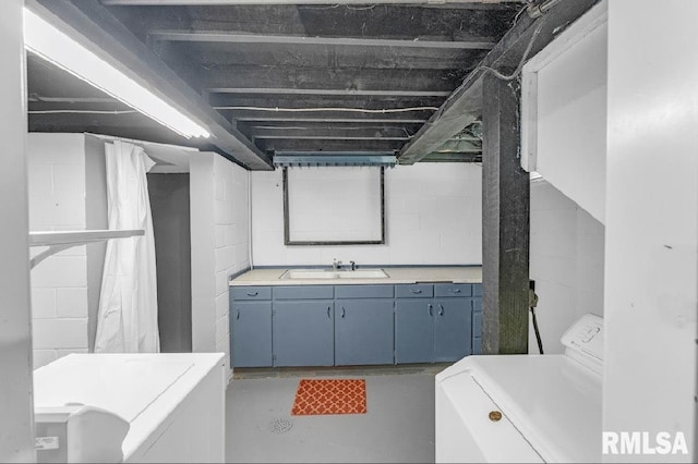 full bath with concrete flooring, concrete block wall, toilet, and vanity