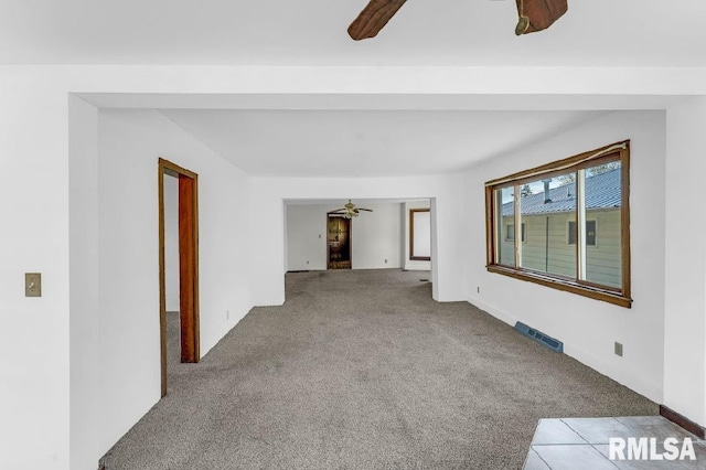 unfurnished room featuring ceiling fan and carpet floors
